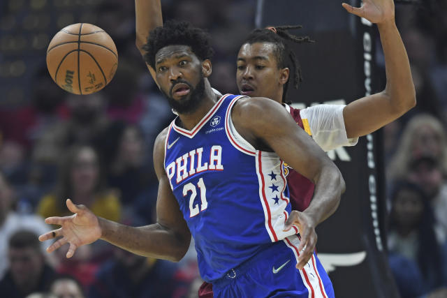Philadelphia 76ers center Joel Embiid (21) reacts after turning the ball over in the first half of an NBA basketball game against the Cleveland Cavaliers, Sunday, April 3, 2022, in Cleveland. (AP Photo/David Dermer)
