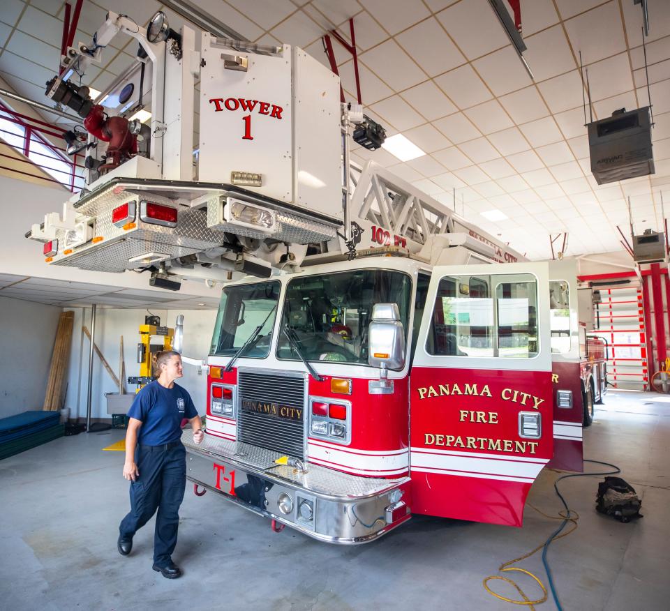 Engineer Amanda Scoggin walks around Tower 1 at the Panama City Fire Station No. 1 on Tuesday. The ladder truck at the station is being replaced with a new truck in 2023. Funds for the purchase come from the city's fire protection assessment and general fund aid. The City Commission on Tuesday approved a 4.62% increase to the assessment.