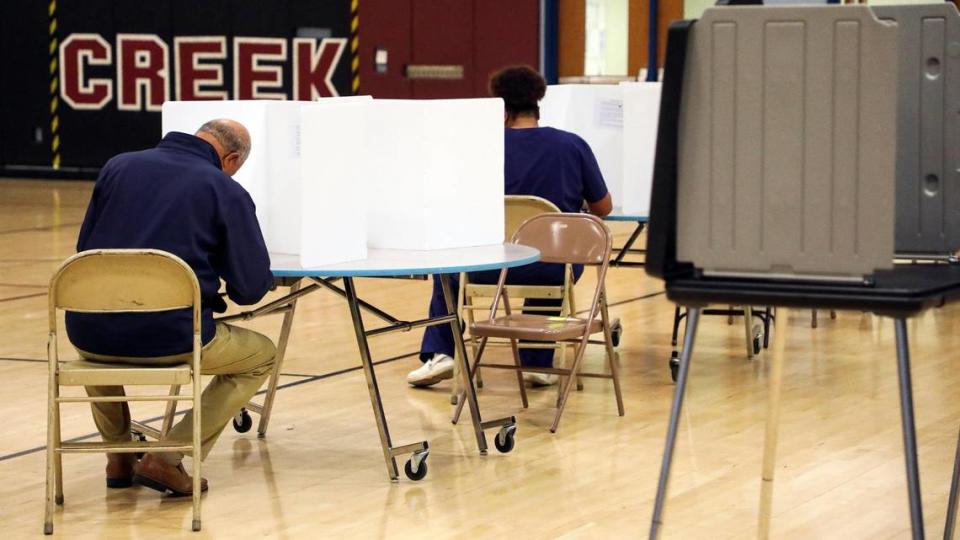 Voter cats their ballots for the 2023 statewide general election at the Kirklevington precinct at Tates Creek Middle School, Tuesday, November 7, 2023 in Lexington, Ky.