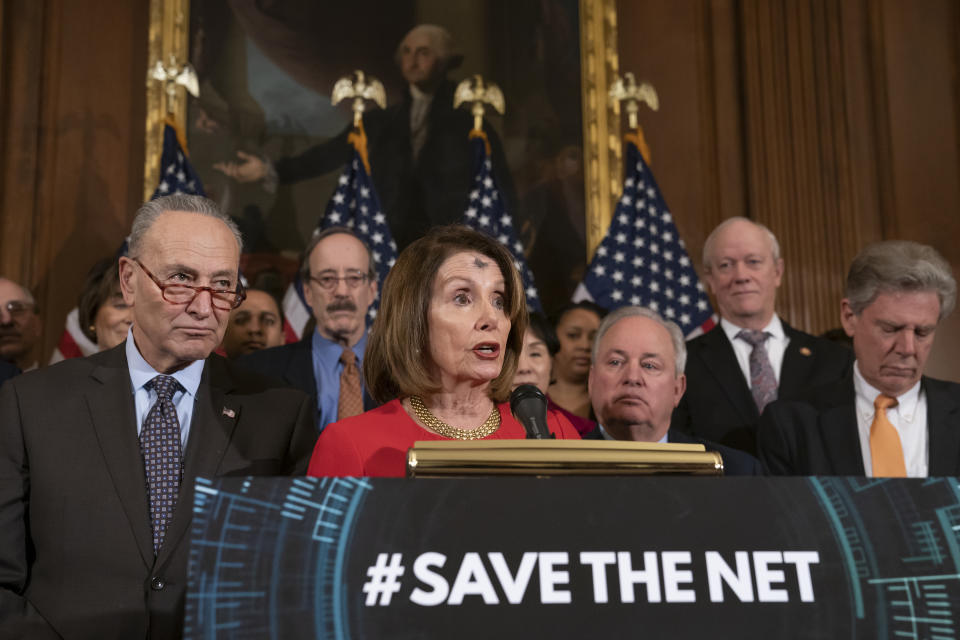 Speaker of the House Nancy Pelosi, D-Calif., joined by Senate Minority Leader Chuck Schumer, D-N.Y., left, announces the "Save The Internet Act," congressional Democrats' plan to reinstate "net neutrality" rules that President Donald Trump repealed in 2017, during an event at the Capitol in Washington, Wednesday, March 6, 2019. The bill is sponsored by Rep. Mike Doyle, D-Pa., right, with House Energy and Commerce Committee Chair Frank Pallone, D-N.J., far right. (AP Photo/J. Scott Applewhite)