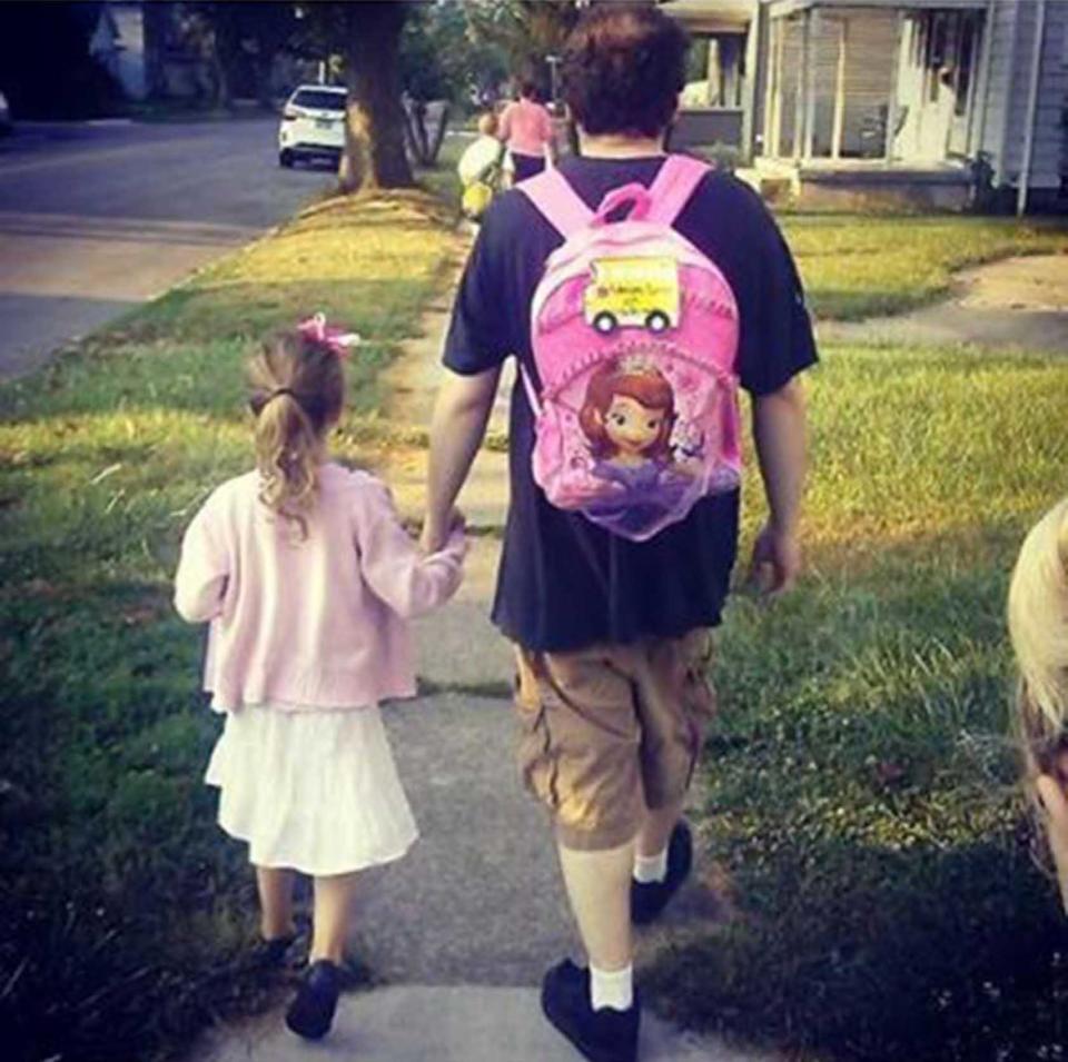 "My daughter and her step dad on her first day of school"