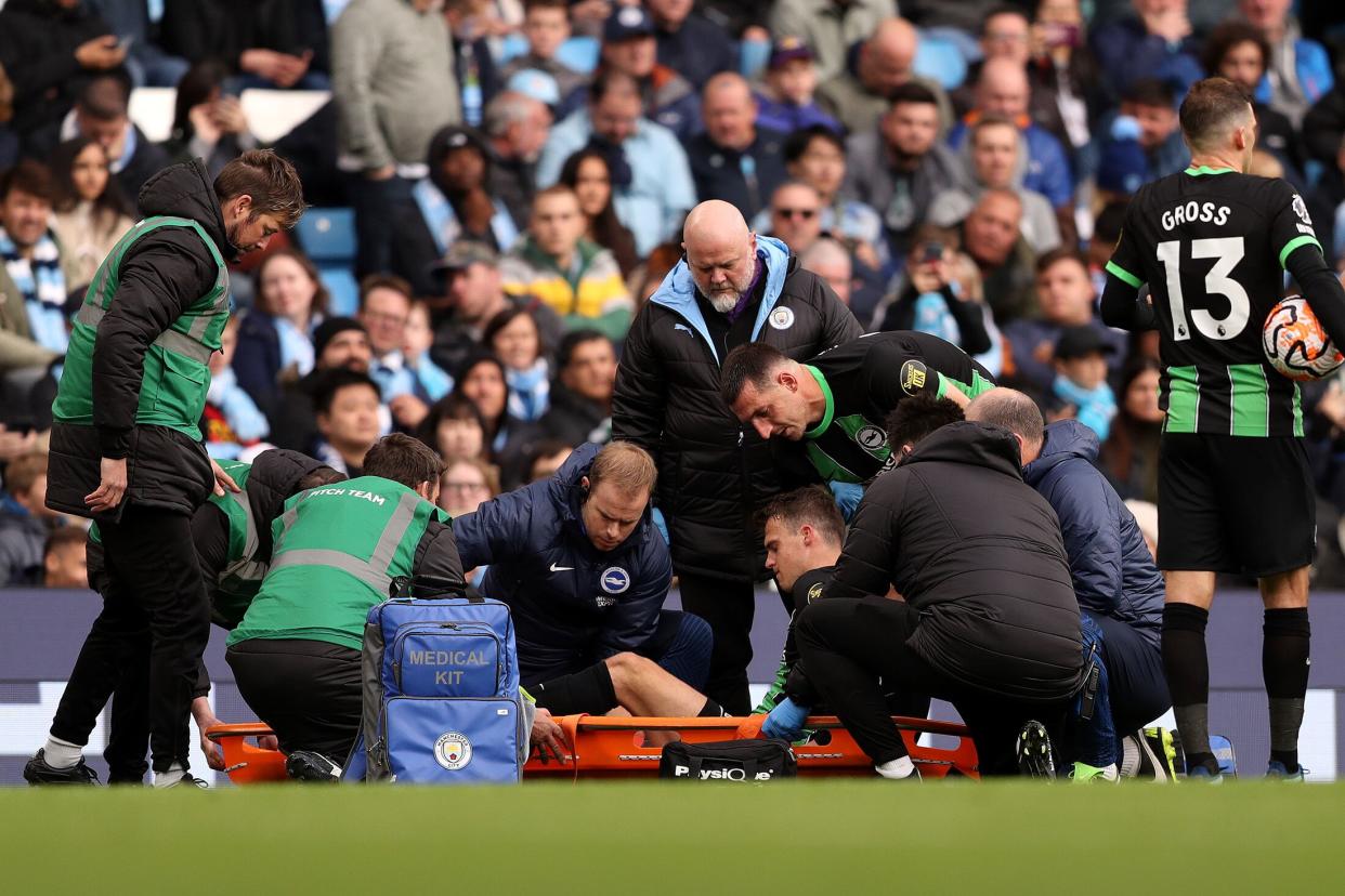 Solly March of Brighton & Hove Albion leaves the field on a stretcher after receiving medical treatment during the Premier League match between Manchester City and Brighton & Hove Albion at Etihad Stadium on Oct. 21, 2023 in Manchester, England. (Photo: Charlotte Tattersall/Getty Images via Bloomberg)