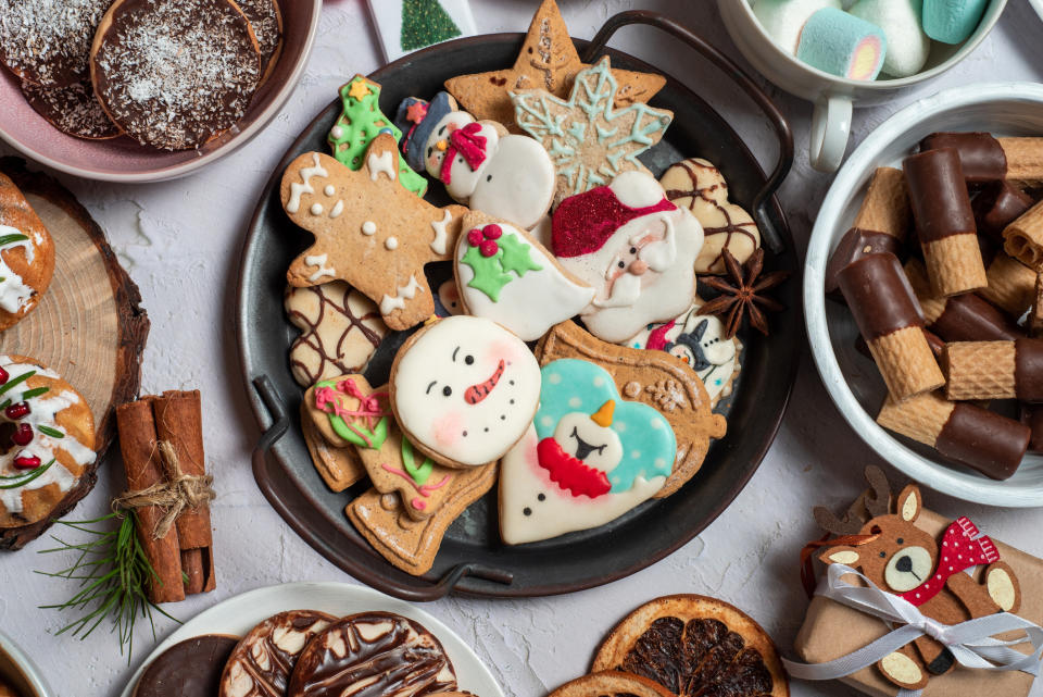 A table setting with Christmas cookies in the middle