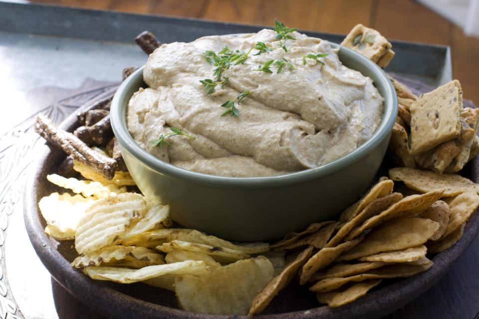 In this Feb. 18, 2013 photo, carmelized onion and Guinness dip is shown served in a bowl in Concord, N.H. (AP Photo/Matthew Mead)