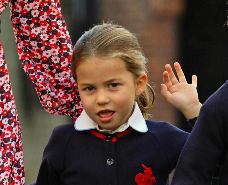 Britain's Princess Charlotte of Cambridge gestures as she arrives for her first day of school at Thomas's Battersea in London on September 5, 2019. (Photo by Aaron Chown / POOL / AFP)        (Photo credit should read AARON CHOWN/AFP/Getty Images)