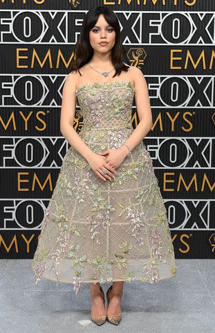 <p>David Fisher/Shutterstock</p> Jenna Ortega on the Emmys carpet