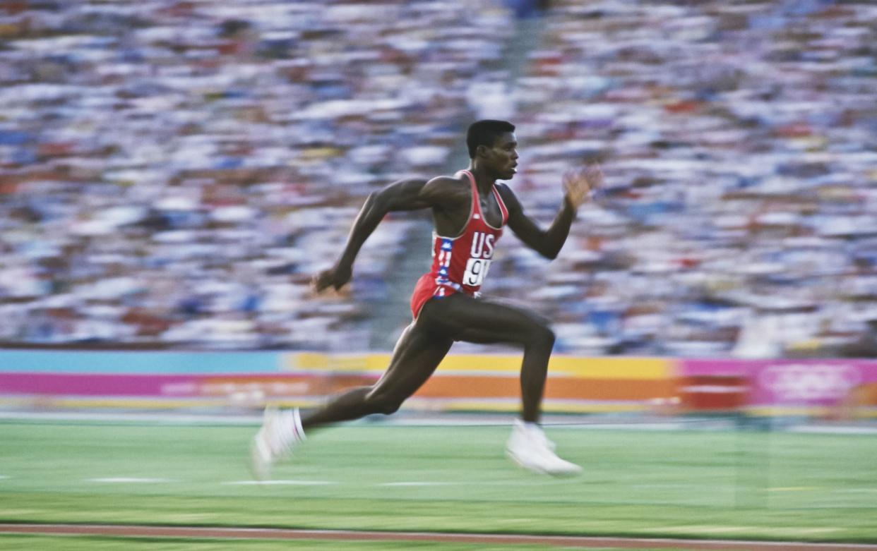 American athlete Carl Lewis accelerates down the runway as he competes in the Men's Long Jump event at the XXIII Olympic Summer Games at the Los Angeles Memorial Coliseum, Los Angeles