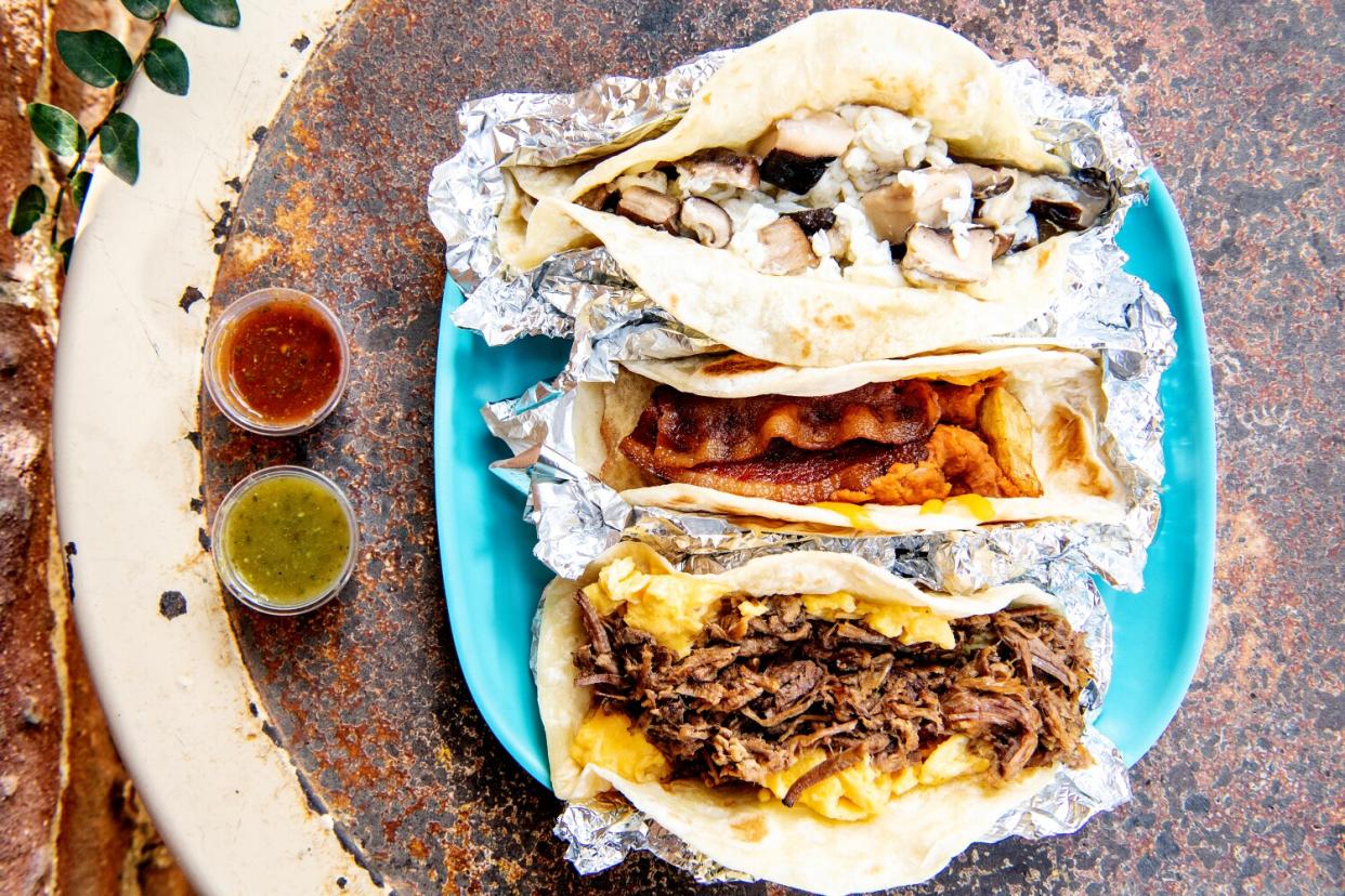 An overhead photo of Breakfast tacos from HomeState, including (from bottom up) Pecos, Don't Mess with Texas and Blanco.