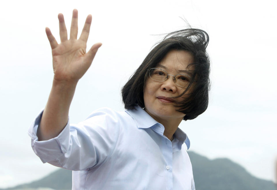 FILE - In this May 4, 2019, file photo, Taiwan's President Tsai Ing-wen waves to press during an offshore anti-terrorism drill outside the Taipei harbor in New Taipei City, Taiwan. Recent anti-government protests in Hong Kong are echoing in Taiwan, possibly giving the island's President Tsai a lift in her campaign to resist Beijing's pressure for political unification and win a second term in next year's elections. (AP Photo/Chiang Ying-ying, file)
