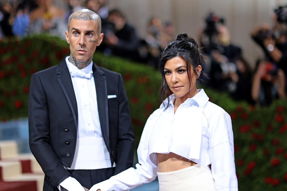 Rumours are swirling over whether or not Kourtney Kardashian-Barker has given birth after her husband Travis Barker's band Blink-182 abruptly cancelled UK tour dates. (Credit: Getty Images)
