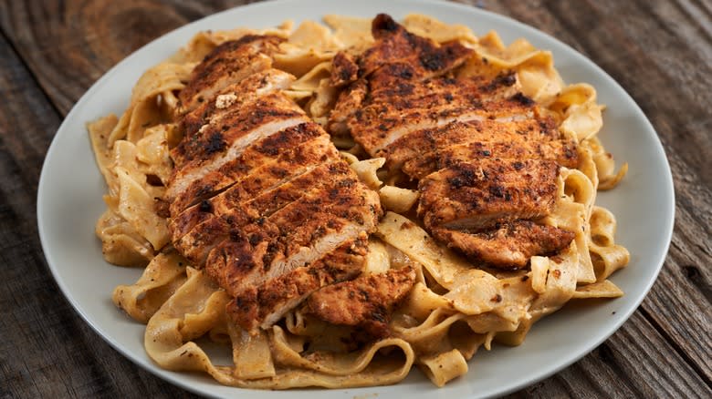 Blackened chicken on Alfredo fettuccine pasta