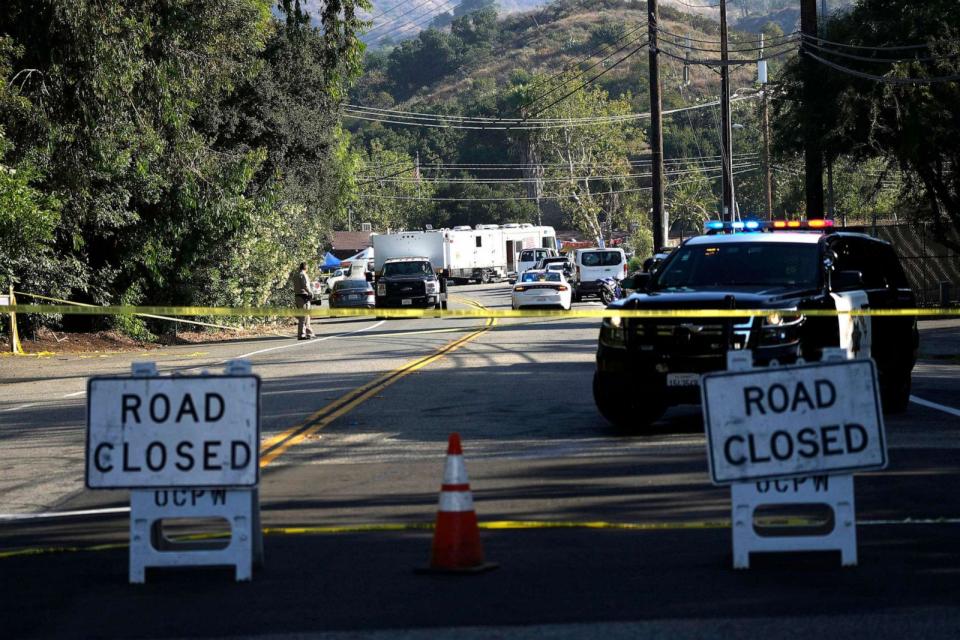 PHOTO: Road closure signs are place at the scene of a mass shooting at Cook's Bar, on Aug. 24, 2023, in Trabuco Canyon, Calif. Gunfire at a popular Southern California biker bar killed three people and wounded several others. (Jae C. Hong/AP)