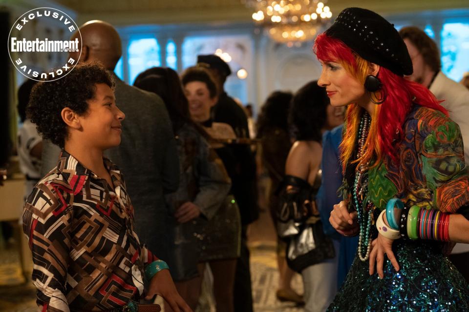 YOUNG ROCK -- "The People Need You" Episode 301 -- Pictured: (l-r) Adrian Groulx as Dwayne Johnson, Rebecca Quin as Cyndi Lauper -- (Photo by: Katherine Bomboy/NBC)