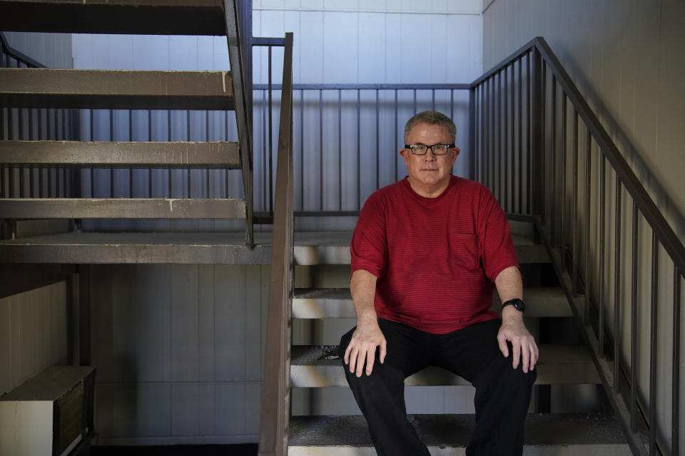 Larry Holt, poses for a portrait outside of his apartment, Thursday, Nov. 19, 2020, in Las Vegas. Holt lost his casino job during the coronavirus pandemic and gets food delivered from a food bank. (AP Photo/John Locher)