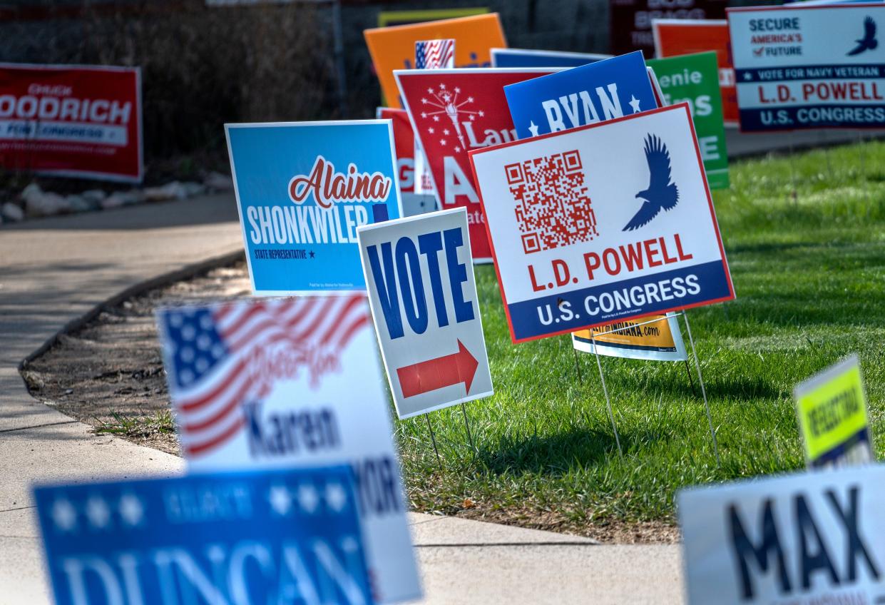 Candidate signs line the walkway up to the Hamilton County Fairgrounds polling site for voters to see before early voting Tuesday, April 16, 2024 in Noblesville. The primary election is on May 7, 2024.