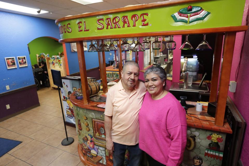 Owners Albino and Maria Carmen Herrera stand in the entryway of El Sarape, a Mexican restaurant located at 2030 E. Mason St., in March 2023.