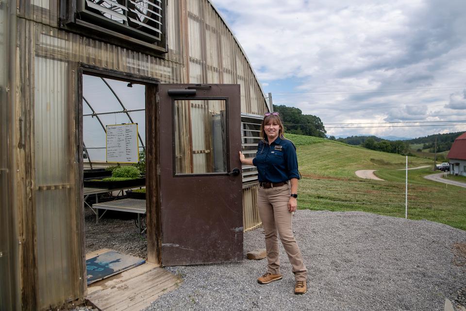 Gardener Sarah Woodby opens the door to one of Biltmore’s hydroponic greenhouses on the Biltmore Estate in Asheville, September 13, 2023.