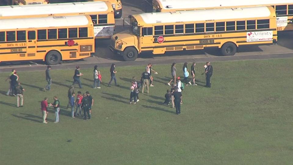 Students exit Santa Fe High School.