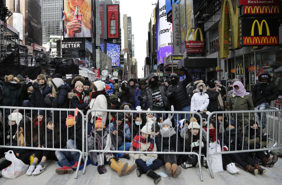 <p>Spectators gather ahead of the New Year’s Eve celebration in Times Square in New York, on Sunday, Dec. 31, 2017. New Yorkers, celebrity entertainers and tourists from around the world will pack into Times Square for what’s expected to be a flashy but frigid celebration marking the start to the new year. (Photo: Peter Morgan/AP) </p>