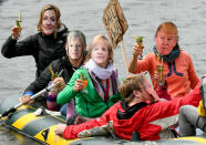 <p>Participants of the protest against the G20 Summit demonstrate on an inflatable boat wearing masks with the likeness of from left: High Representative of the European Union for Foreign Affairs, Federica Mogherini, British Prime Minister Theresa May, German Chancellor Angela Merkel and US President Donald Trump in Hamburg, Germany, Sunday, July 2, 2017. (Axel Heimken/dpa via AP) </p>