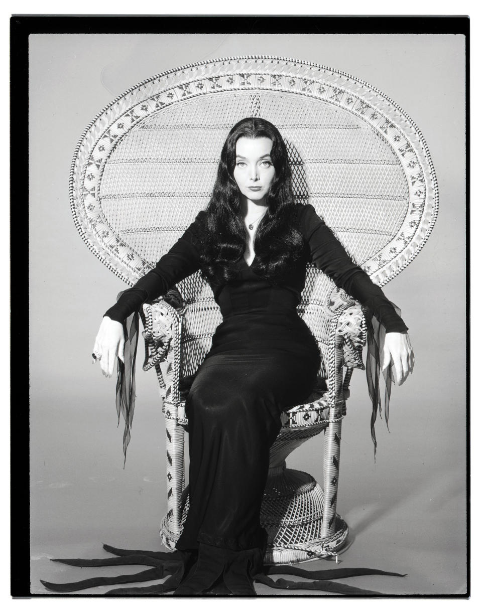 Morticia Addams, as portrayed by Carolyn Jones, is perhaps one of the most elegant spooky ladies we've seen on screen. Her long black tresses paired with her fitted black dress and blood red nails made for a classic look that's easy to DIY. Add some gothic-style rings for a more embellished appearance, and you're good to go.