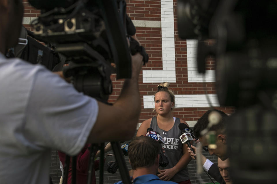 Temple University field hockey player Lucy Reed waits to be interviewed at the conclusion of practice at Howarth Field in Philadelphia, Tuesday, Sept. 10, 2019. The team's game at Kent State on Saturday against Maine was cancelled due to pregame football fireworks. After the shock wore off of halting a women's field hockey game in the middle of overtime just so they could shoot off fireworks for a football game that hadn't even started, the captain of the Maine team said it's par for the course when you're a female athlete. Indeed, for all the advances created by Title IX, there's still an awful lot of hearts and minds that still need changing. (Heather Khalifa/The Philadelphia Inquirer via AP)