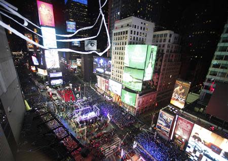 Revelers fill Times Square during New Year's Eve celebrations in New York December 31, 2013. REUTERS/Gary Hershorn