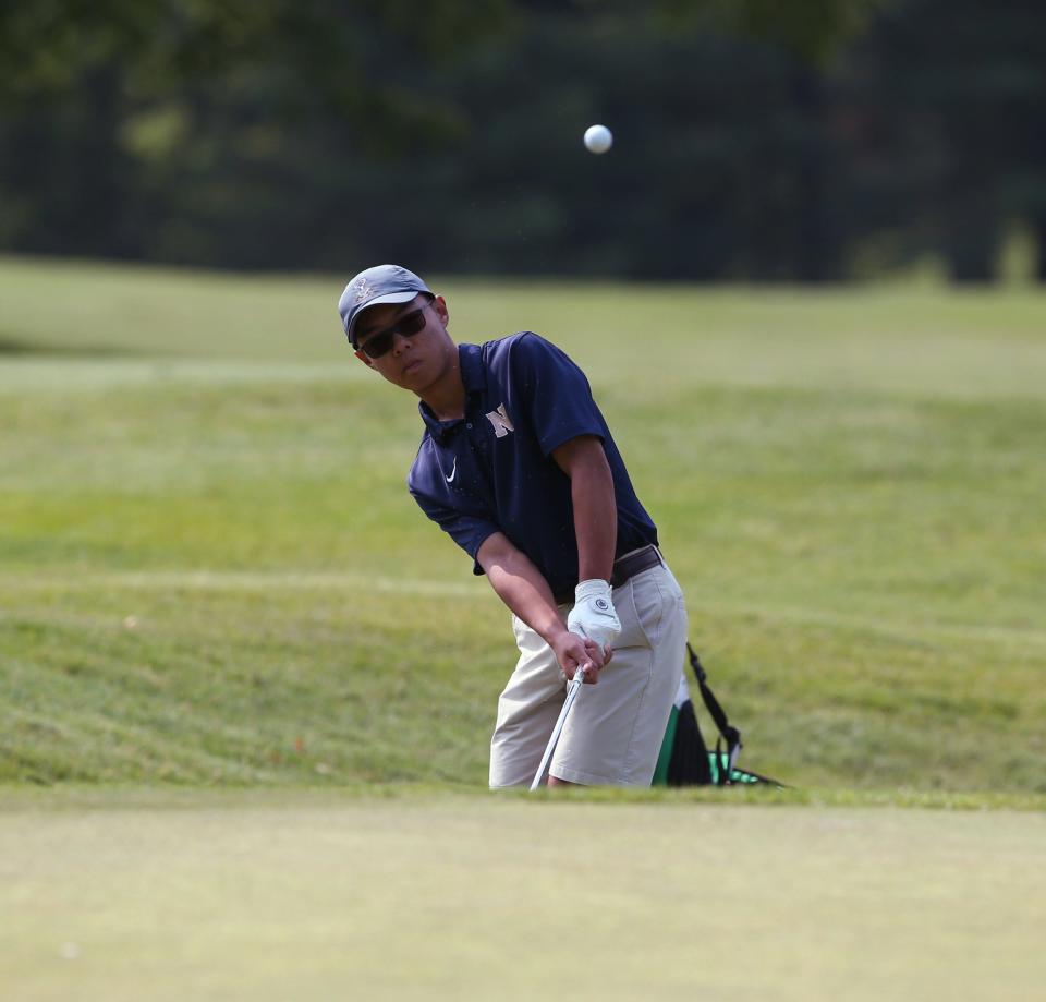 Newburgh's Josh Yan chips onto the 6th green at the Powelton Club in Newburgh during round 1 of the Section 9 golf championship on May 23, 2023. 