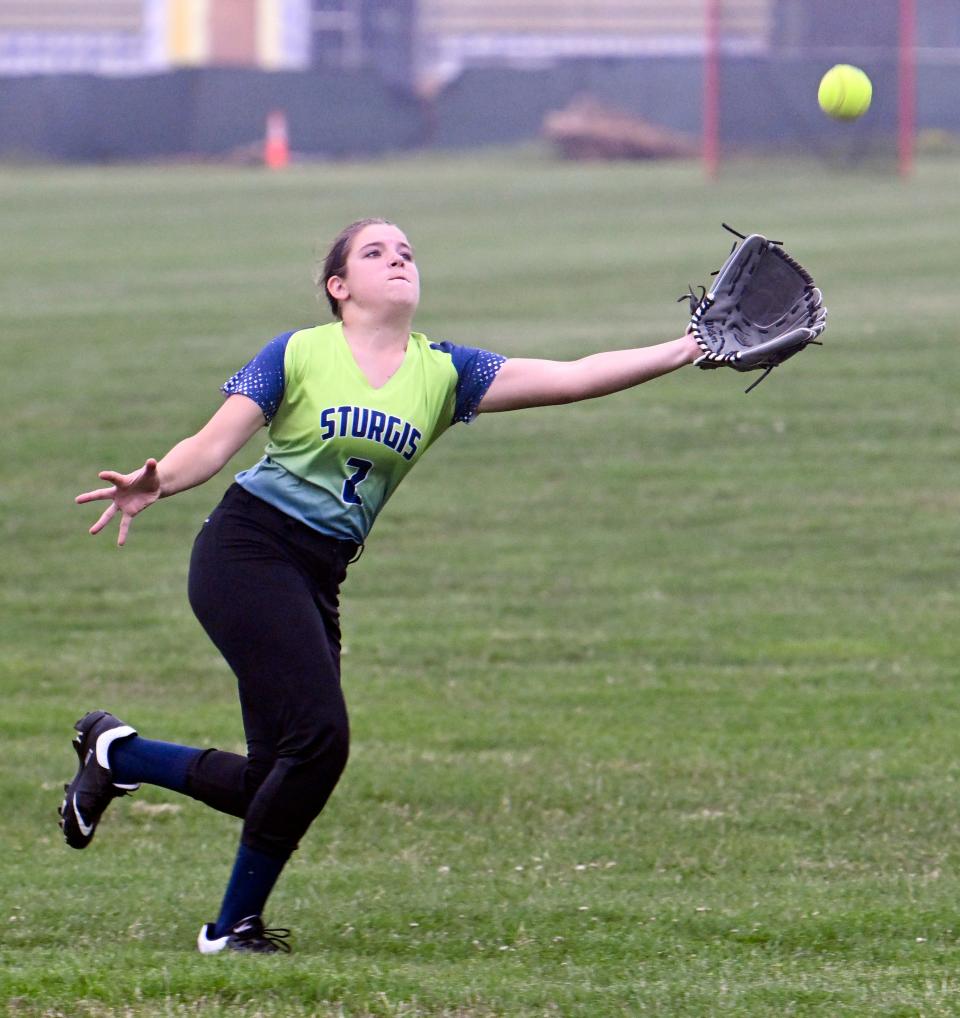 Sturgis right fielder Molly Reino stretches for a D-Y hit that dropped just out of her reach.