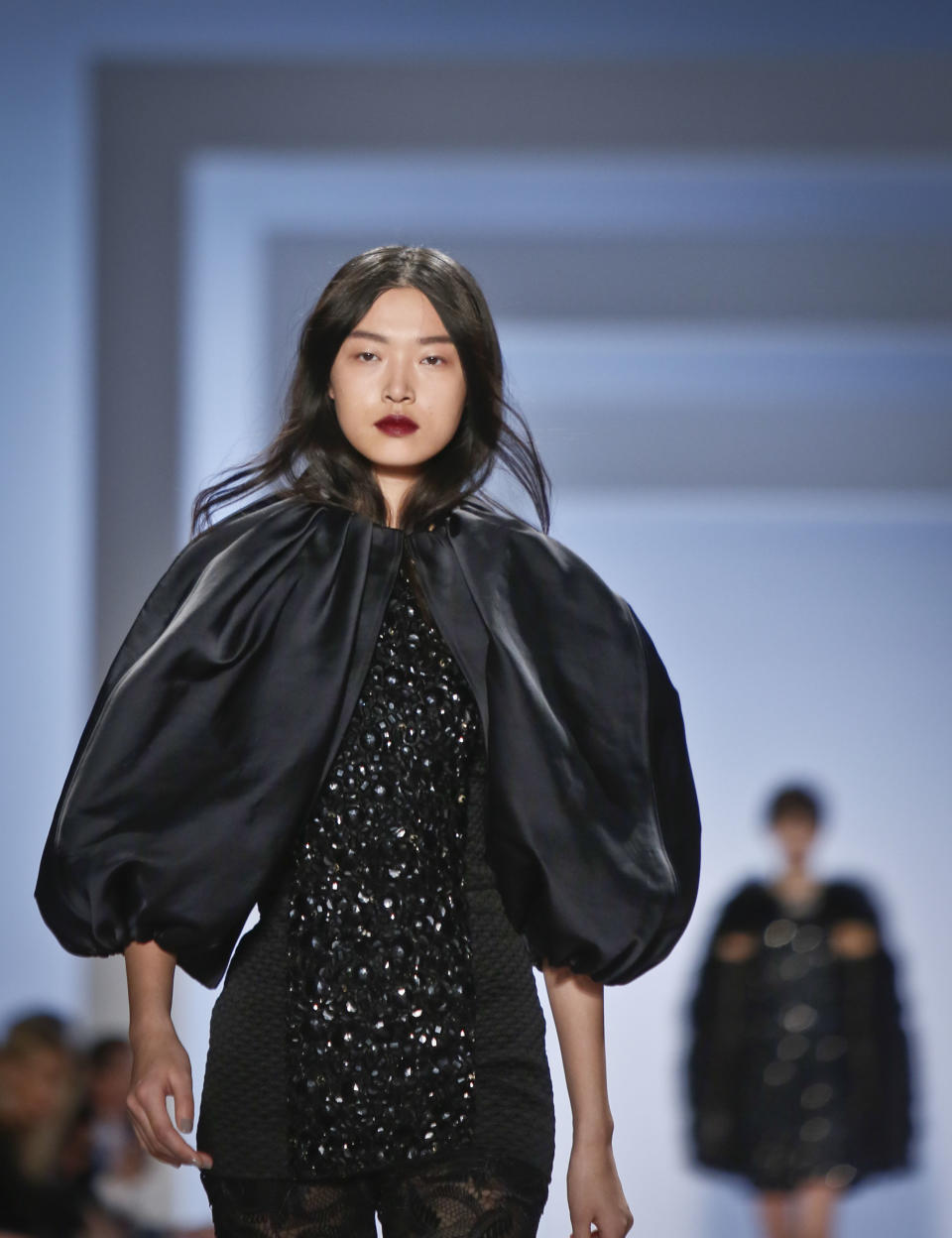 Fashion from the Vera Wang Fall 2013 collection is modeled on Tuesday, Feb. 12, 2013 in New York. (AP Photo/Bebeto Matthews)