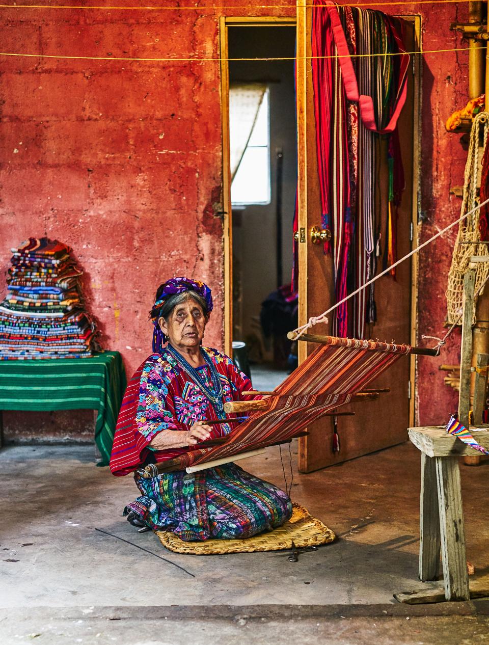 Sente Macajol weaving on a backstrap loom.