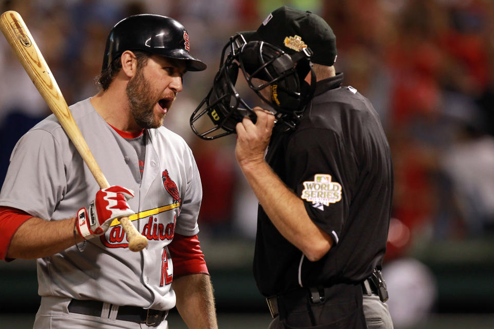 ARLINGTON, TX - OCTOBER 23: Lance Berkman #12 of the St. Louis Cardinals argues with home plate umpire Ron Kulpa after being called out on strikes in the seventh inning during Game Four of the MLB World Series against the Texas Rangers at Rangers Ballpark in Arlington on October 23, 2011 in Arlington, Texas. (Photo by Ronald Martinez/Getty Images)