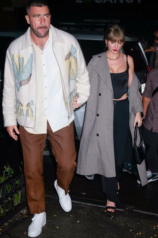 <p>Gotham/GC Images</p> Travis Kelce and Taylor Swift arrive at the "SNL" after-party at Catch Steak in N.Y.C.