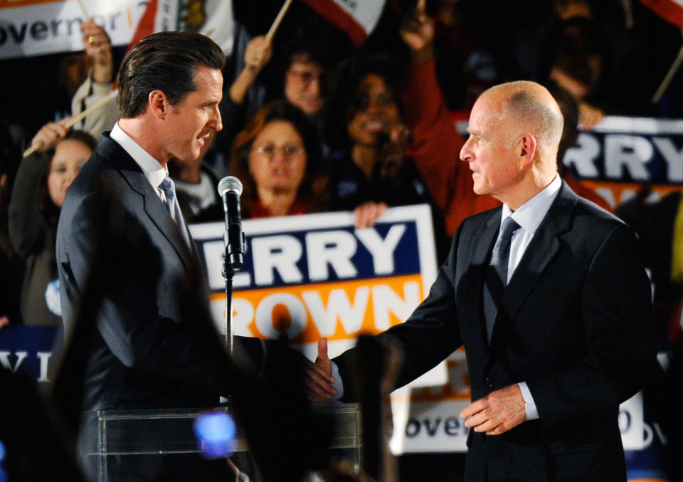 San Francisco Mayor Gavin Newsom, left, introduces Democratic gubernatorial candidate and California Attorney General Jerry Brown at a Democratic National Committee rally on the UCLA campus in October 2010. (Photo: Kevork Djansezian/Getty Images)