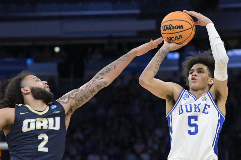 Duke guard Tyrese Proctor (5) shoots as Oral Roberts guard Kareem Thompson (2) defends during the second half of a first-round college basketball game in the NCAA Tournament, Thursday, March 16, 2023, in Orlando, Fla. (AP Photo/Phelan M. Ebenhack)