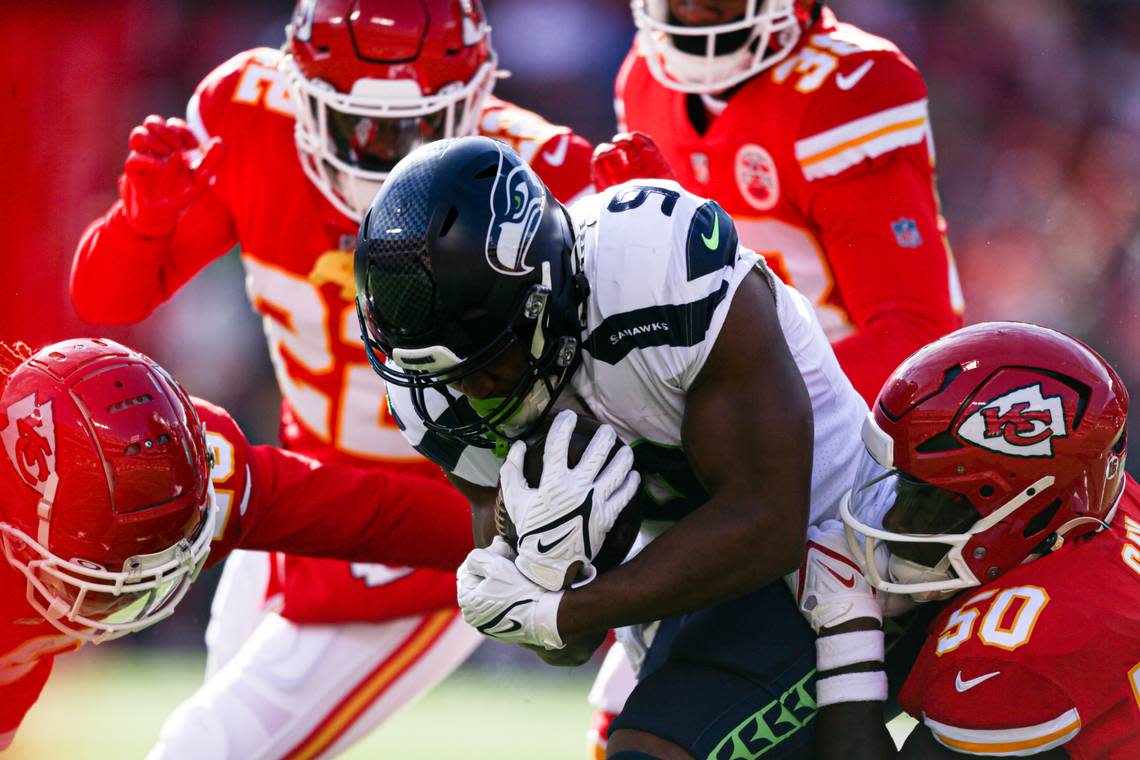 Seattle Seahawks running back Kenneth Walker III (9) is tackled during the first quarter against the Kansas City Chiefs on Saturday, Dec. 24, 2022, in Kansas City, MO.