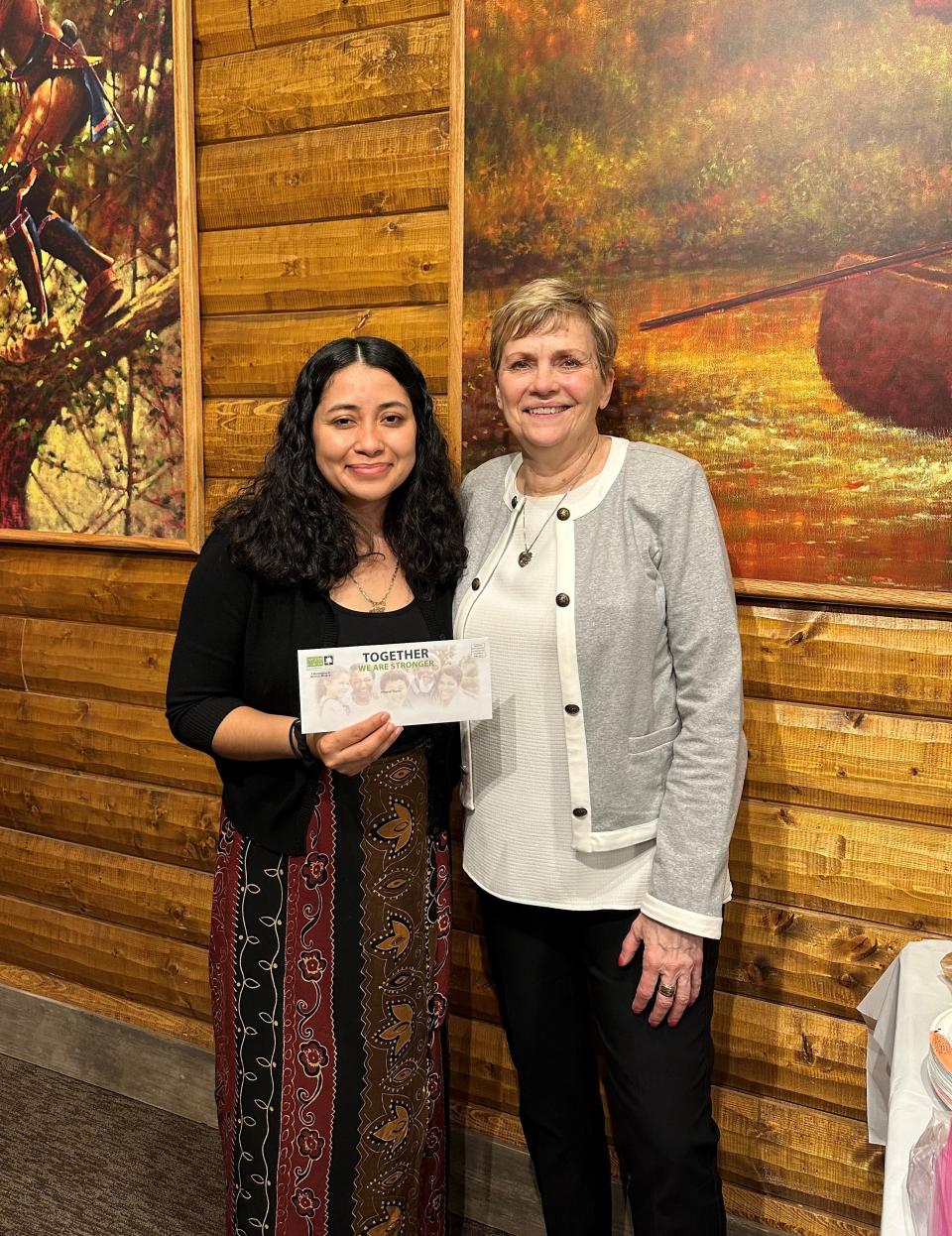 Nancy Lucero from Monroe Puente, left, with Kathy Russeau. Monroe Puente was granted $5,000 from the Community Foundation of Monroe County’s CREED fund to support their folkloric dance program.