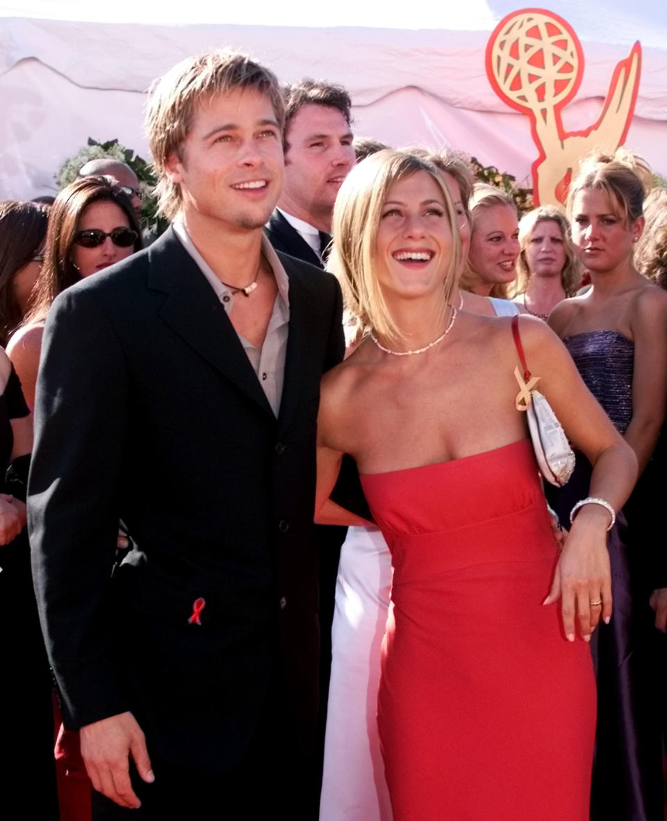 Actor Brad Pitt and his wife actress Jennifer Aniston pose for photographers at the 52nd annual Emmy Awards in Los Angeles, September 10, 2000. Aniston is nominated for outstanding supporting actress in a comedy series for her role in NBC's 