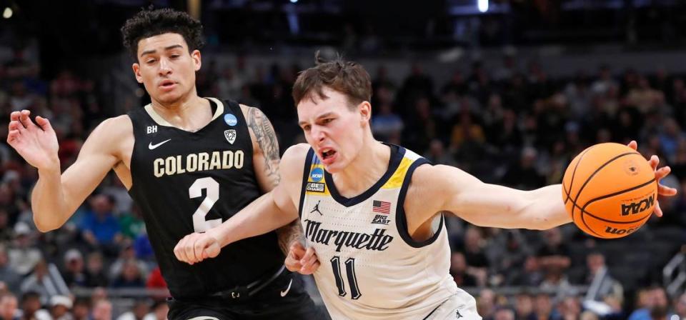 Colorado Buffaloes guard KJ Simpson (2) defends Marquette Golden Eagles guard Tyler Kolek (11) during NCAA Tournament game, Sunday, March 24, 2024, at Gainbridge Fieldhouse in Indianapolis.