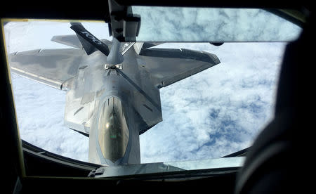 One of two U.S. Air Force F-22 stealth fighter jets receives fuel mid-air from a KC-135 refueling plane over Norway en route to a joint training exercise with Norway's growing fleet of F-35 jets August 15, 2018. REUTERS/Erol Dogrudogan