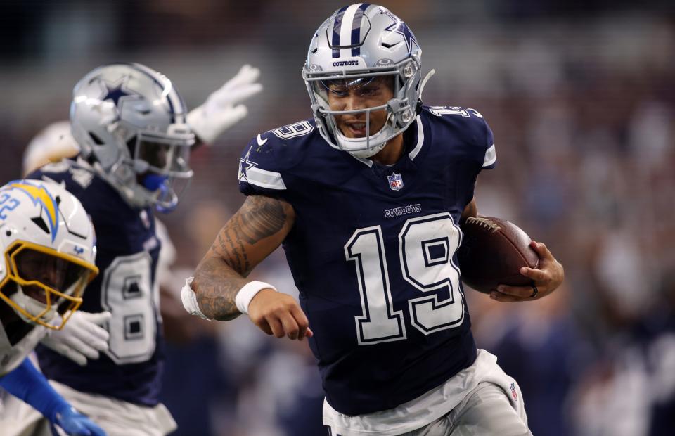 Dallas Cowboys quarterback Trey Lance (19) runs for a touchdown against the Los Angeles Chargers in the third quarter at AT&T Stadium.