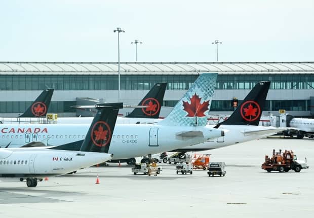 People on an Air Canada flight from Montreal to Charlottetown on April 6 are being asked to be on alert for symptoms as they continue to isolate.  (Nathan Denette/The Canadian Press - image credit)