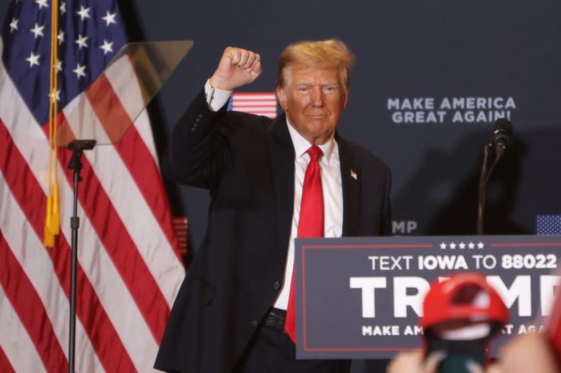 Former President and Republican presidential candidate Donald Trump gestures at a campaign event in Coralville, Iowa on Wednesday. Photo by Alex Wroblewski/UPI