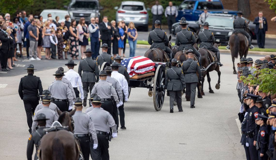 The North Carolina State Highway Patrols Caisson Unit carrying Wake County Deputy Ned Byrds casket arrives at Providence Baptist Church for his funeral on Friday, August 19, 2022 in Raleigh, N.C.