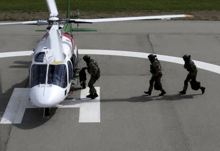 Latvia's border guards special task unit performs exercises as they prepare for patrolling over the EU external border with Russia in the airbase in Ludza, Latvia, in this May 2, 2014 file picture. REUTERS/Ints Kalnins/Files