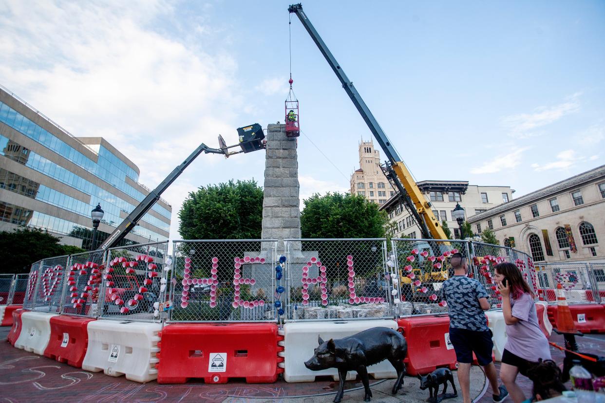 The Vance Monument is disassembled in Pack Square May 25, 2021.