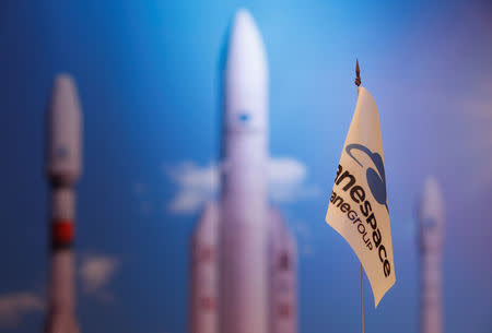 FILE PHOTO: A flag with a company logo is seen during satellite launch company Arianespace annual news conference in Paris, France, January 9, 2018. REUTERS/Christian Hartmann