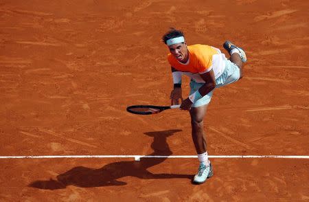 Rafael Nadal of Spain serves to his compatriot David Ferrer during their quarter-final match at the Monte Carlo Masters in Monaco April 17, 2015. REUTERS/Eric Gaillard