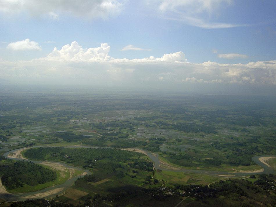 View from an aircraft window of Siliguri, West Bengal, the gateway to the Darjeeling hills. Occupying the Chicken's Neck, a narrow corridor of land bordered by Bangladesh, Bhutan and Nepal and linking the Indian mainland to the northeastern states, Siliguri is an important trade center.<br><br>Mithun Basak is a engineer by profession and a traveler-photographer by passion. His interests include landscapes, nature, wildlife and architecture. Enjoy more of his work at <a href="http://www.beautyaroundme.com/" rel="nofollow noopener" target="_blank" data-ylk="slk:his website;elm:context_link;itc:0;sec:content-canvas" class="link ">his website</a>