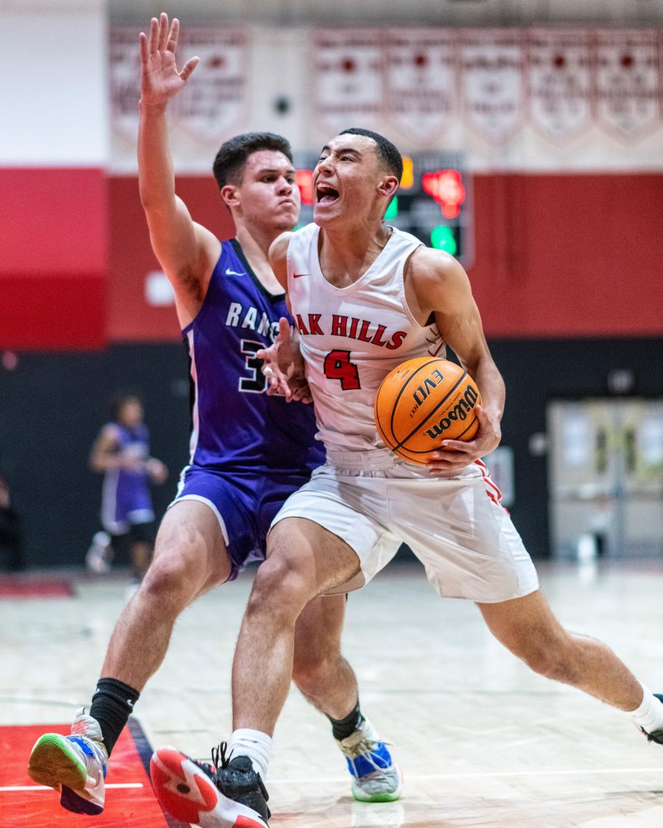 Oak Hills' Isaiah Sharky drives the lane for a basket during the third quarter against Rancho Cucamonga in the semifinals of the CIF-Southern Section Division 3AA playoffs Tuesday, Feb. 22, 2022.